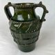 Terracotta jar with dark green handles
