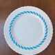 Round vintage plate in earthenware – twisted blue decoration