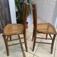 Pair of antique caned and wooden chairs from the 1900s.