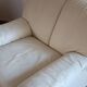 Cinna armchair in cream leather, bolstered armrests, 1970s.