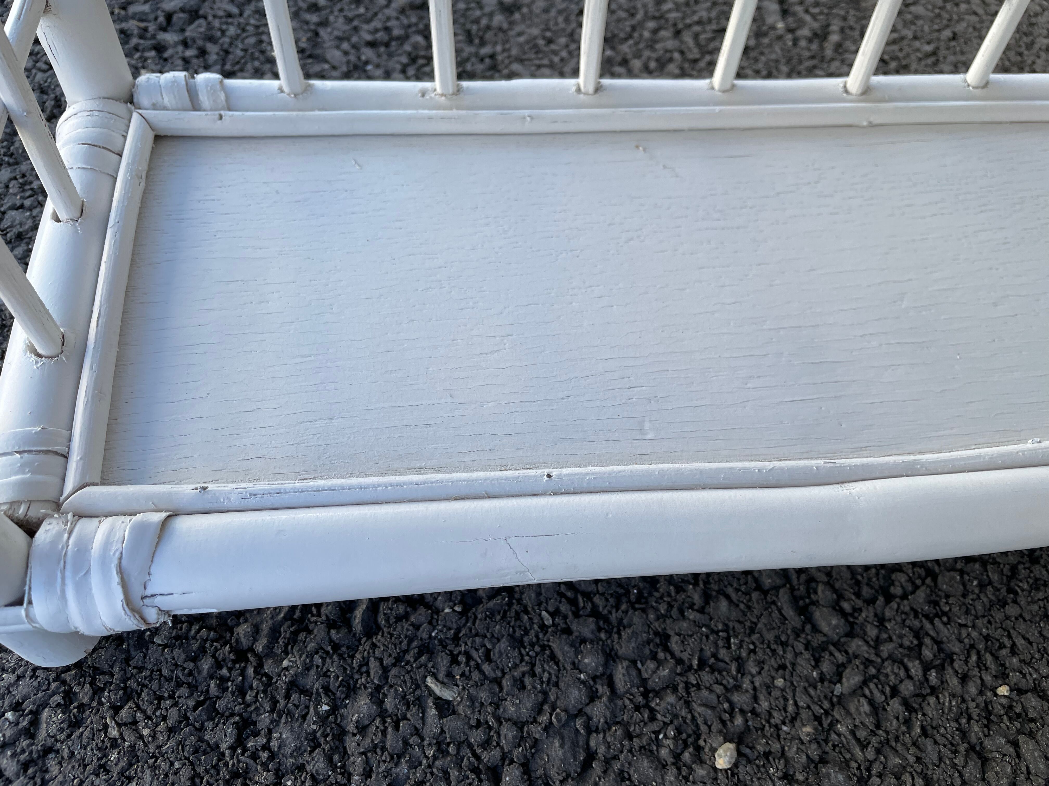 White rattan shelf with braces