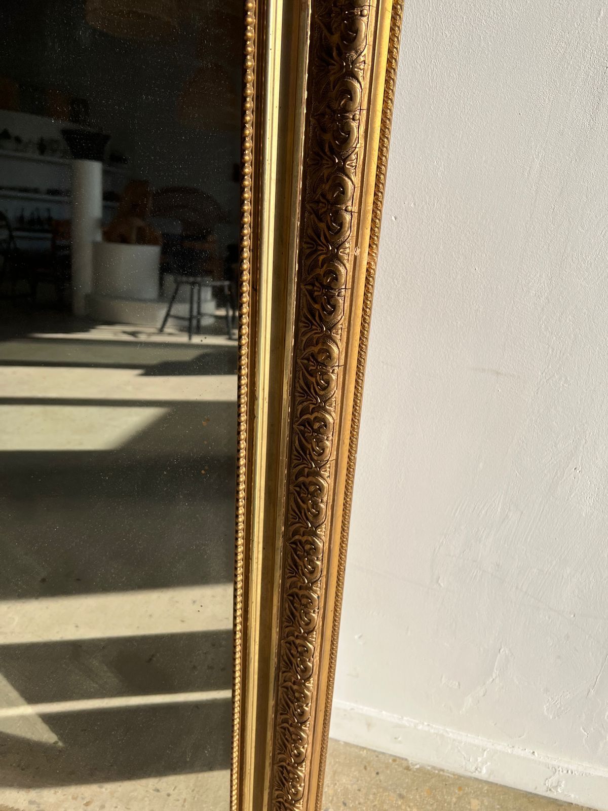 Gilded mirror with frieze h2m10 l:73cm