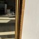 Gilded mirror with frieze h2m10 l:73cm