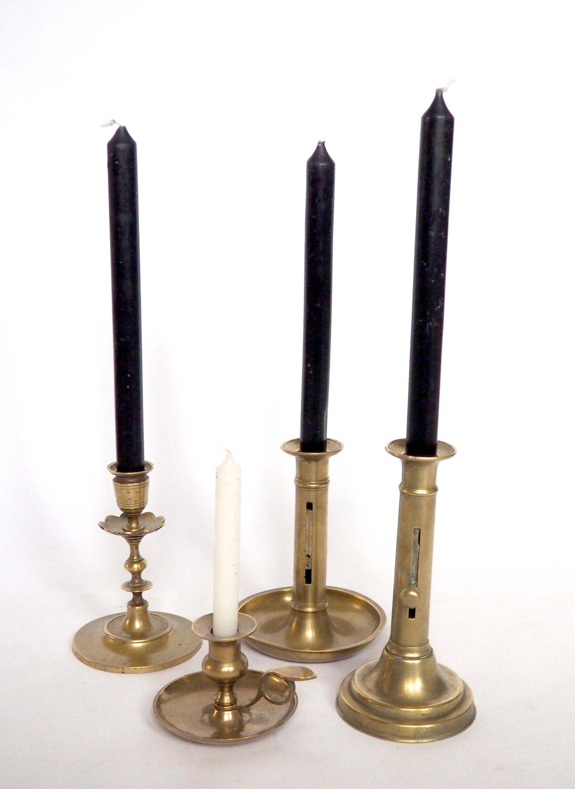 Brass candlestick with a column and bobeche.