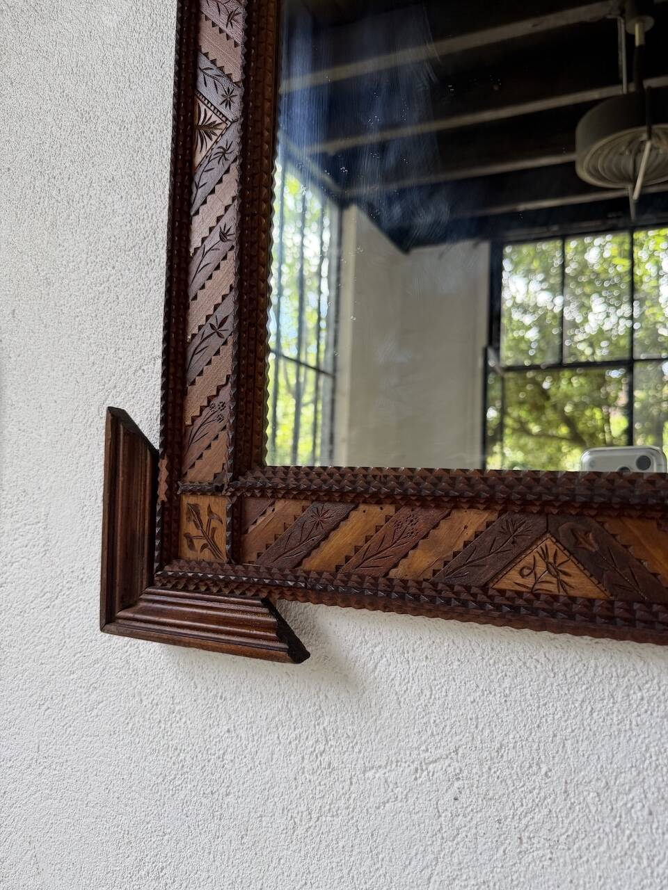 Pair of wooden mirrors in tramp art style