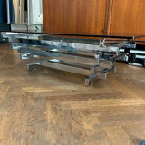 70s design coffee table in rectangular glass with chrome legs.
