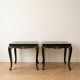 Set of 2 Chinese low tables in black lacquered wood with gold decoration.