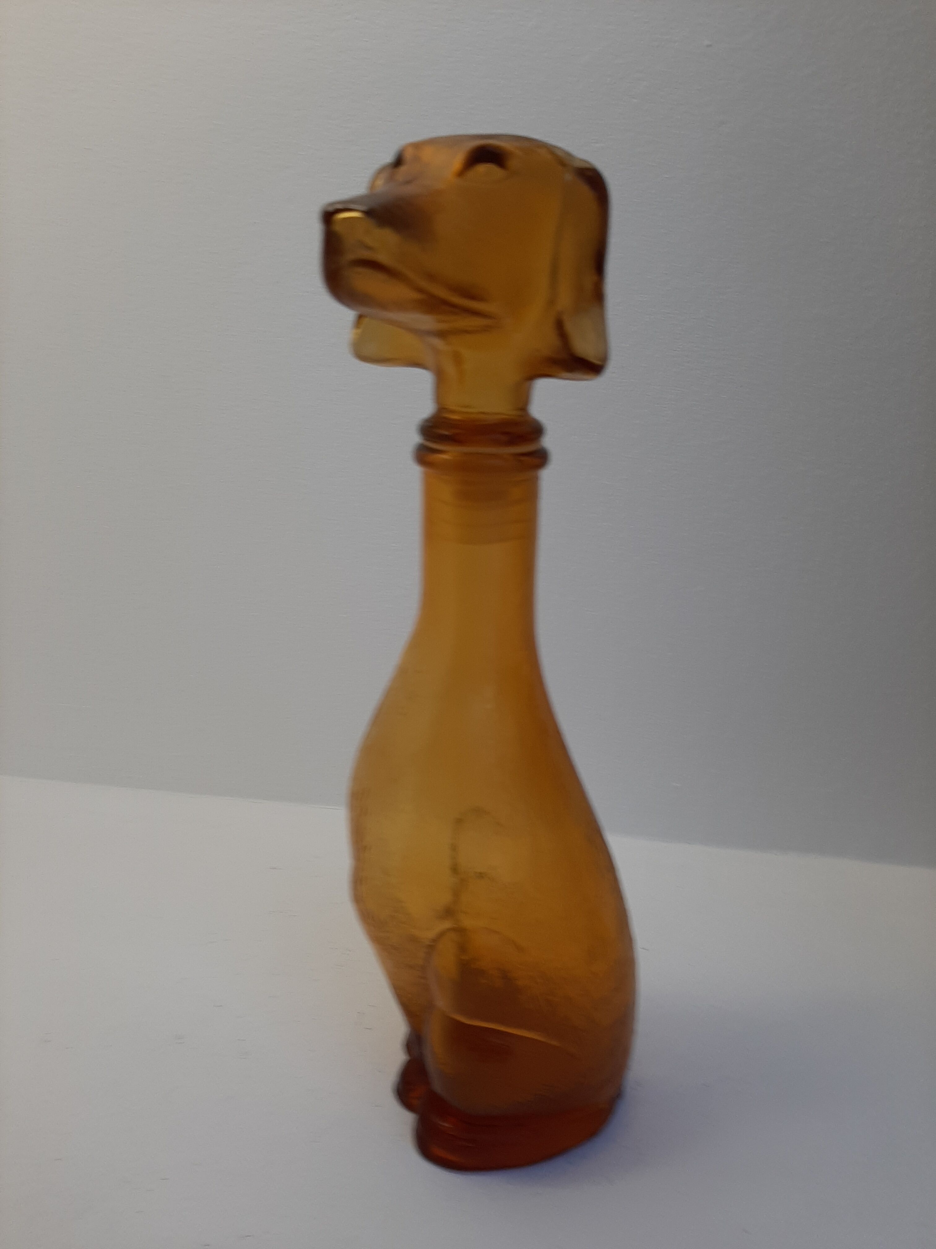 Amber glass bottle representing a dog, Empoli Italy 60s