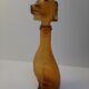 Amber glass bottle representing a dog, Empoli Italy 60s