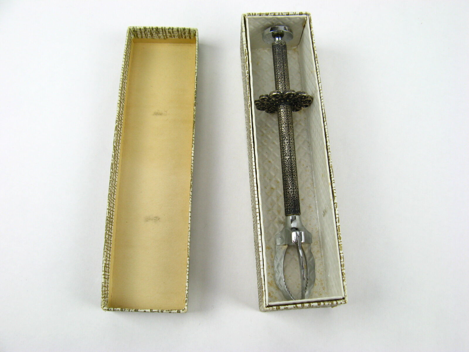 Sugar tongs in its case
