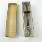 Sugar tongs in its case