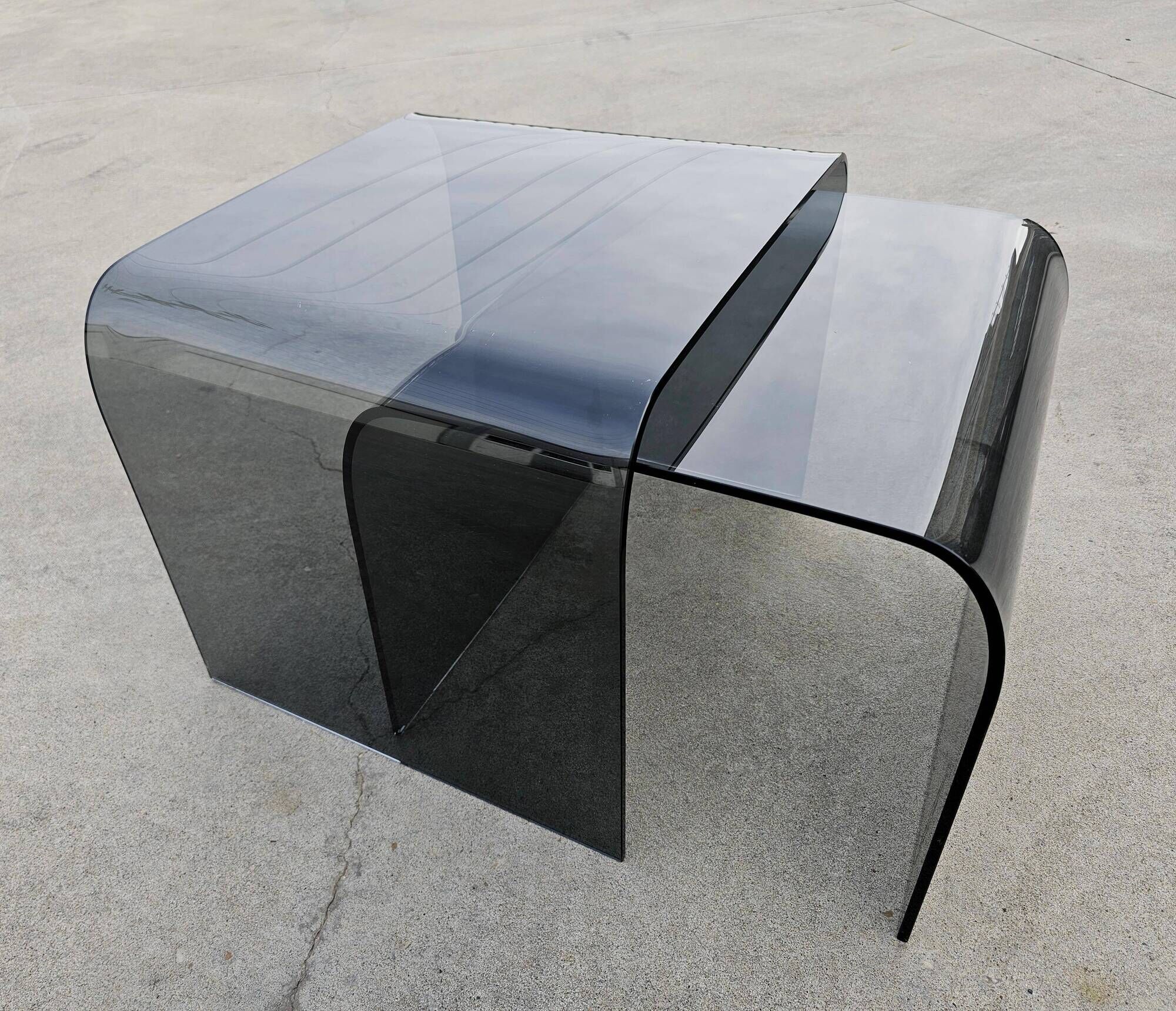 Pair of Waterfall nesting tables in tinted glass attributed to FIAM 1980s.
