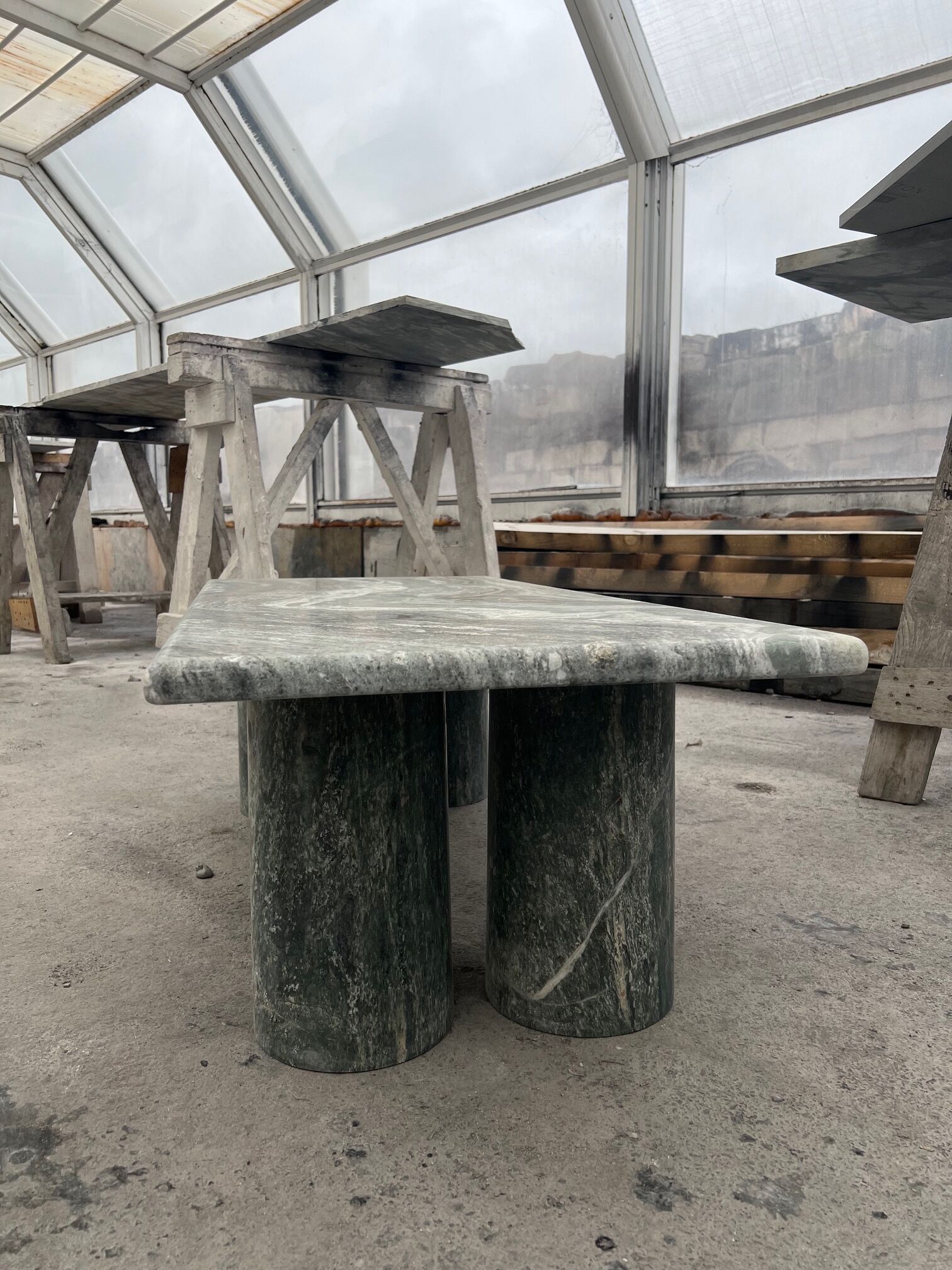 Green marble coffee table with cylindrical legs