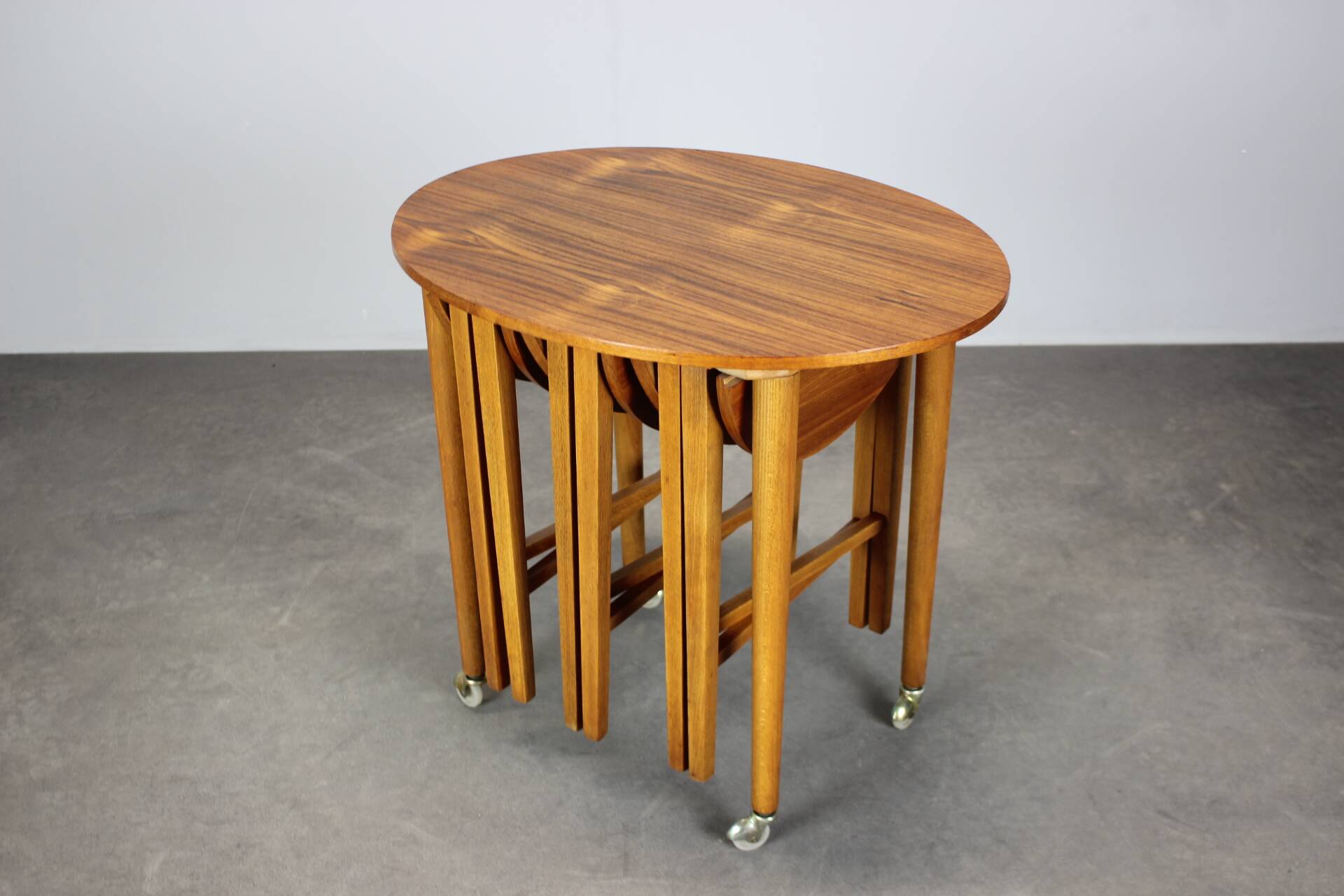 Restored Danish folding teak table with three nesting chairs by Poul Hundevad