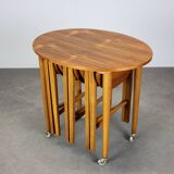 Restored Danish folding teak table with three nesting chairs by Poul Hundevad
