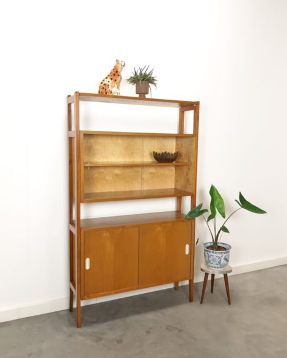 Vintage wooden showcase with sliding doors and white handles