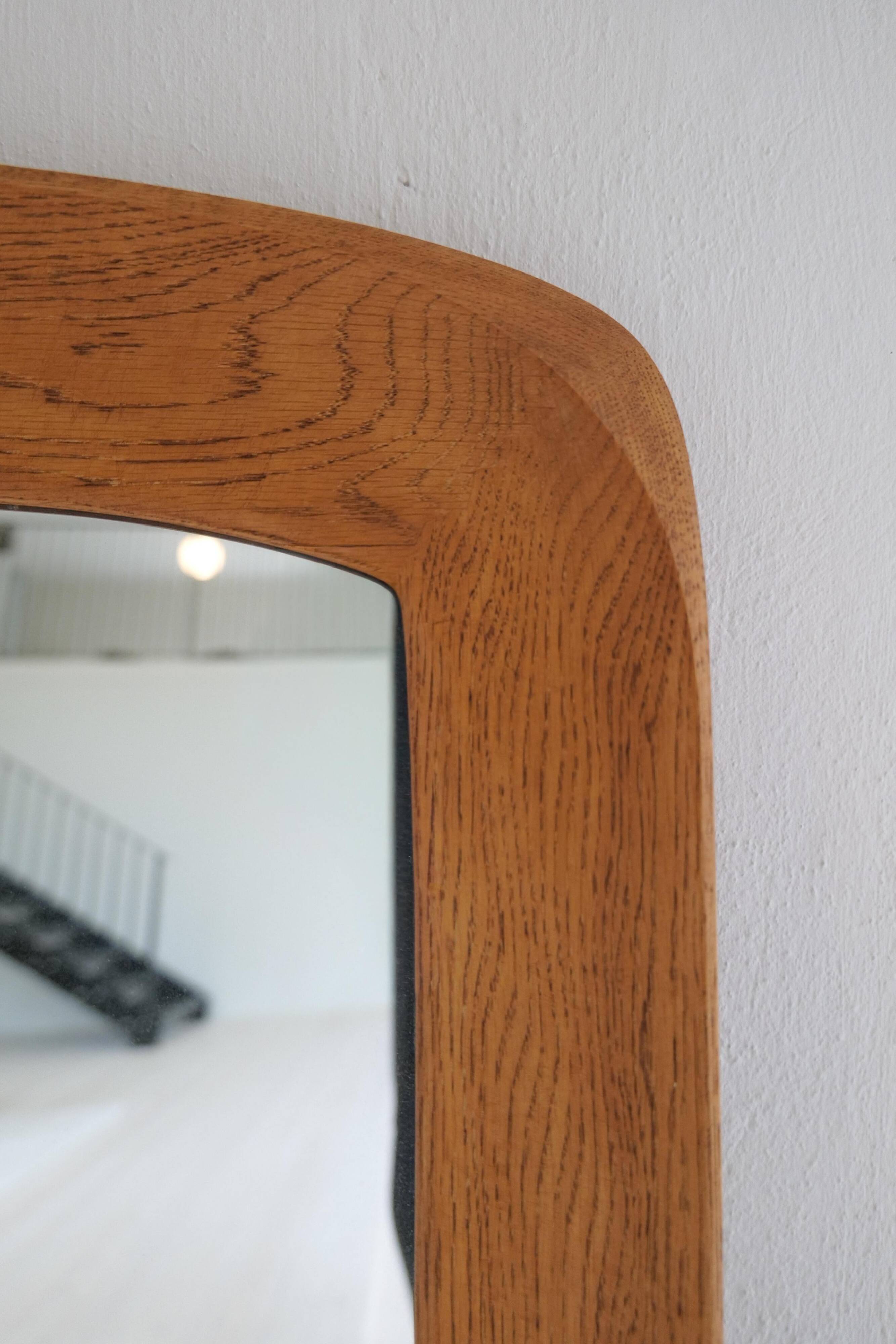 Mid-century modern sculptural wall mirror in stained oak, glass, Glas & Trä 1959