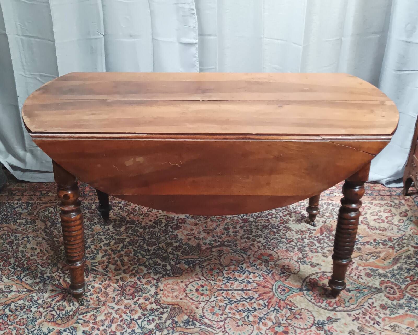 19th-century Louis Philippe walnut drop-leaf table.