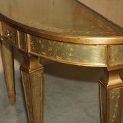 Half-moon console Eglomise Theodore Alexander with a gold finish.