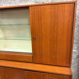 Vintage Scandinavian teak sideboard with compass feet from the 70s