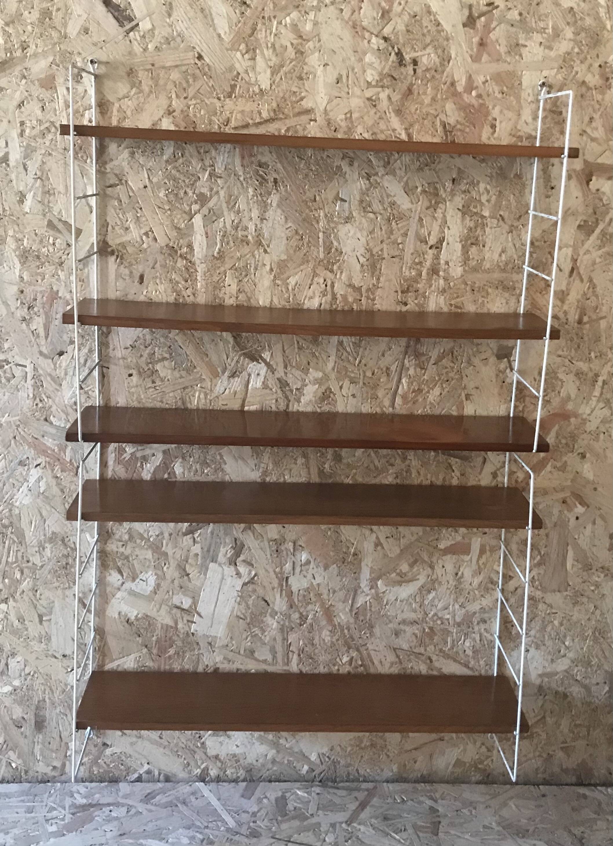 Vintage modular wall shelf with 4 supports and 5 levels.