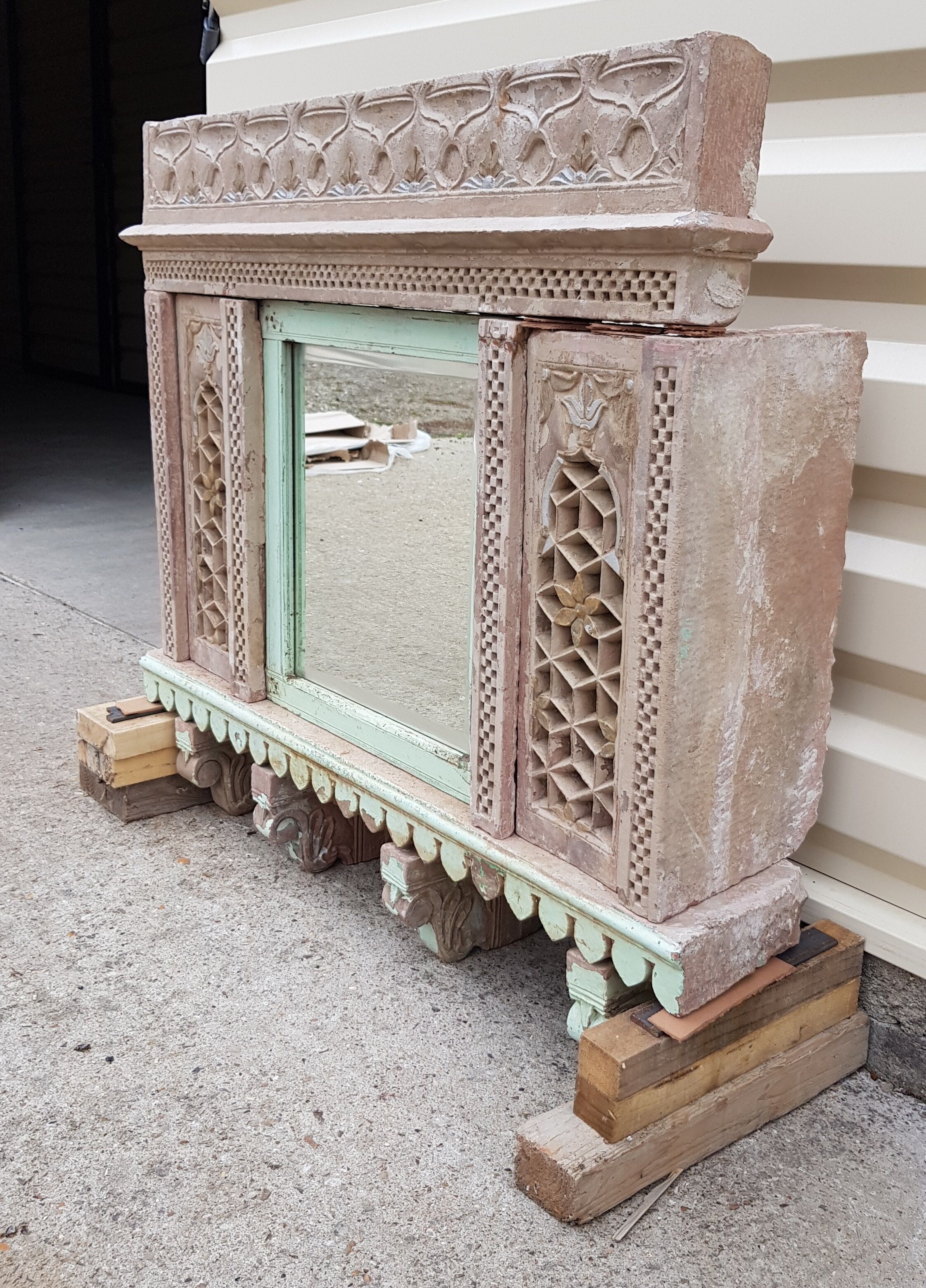 Fully hand-carved stone window with mirror
