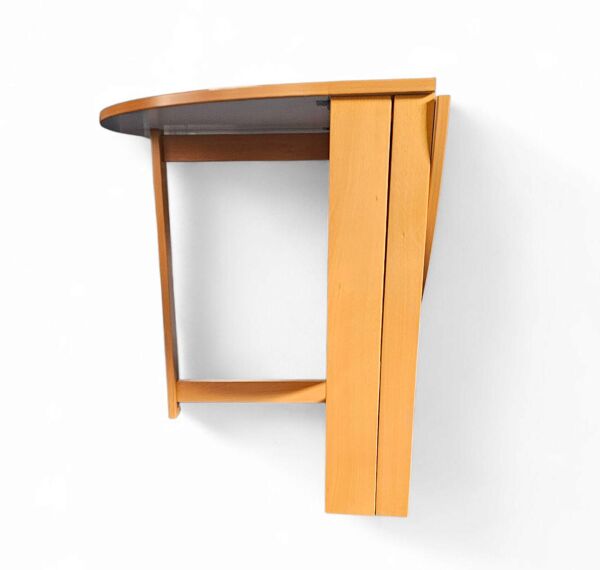 Table à manger pliante scandinave vintage avec rallonges latérales. Le plateau ovale est
