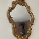 Old italian mirror in gilded plaster with leaf
