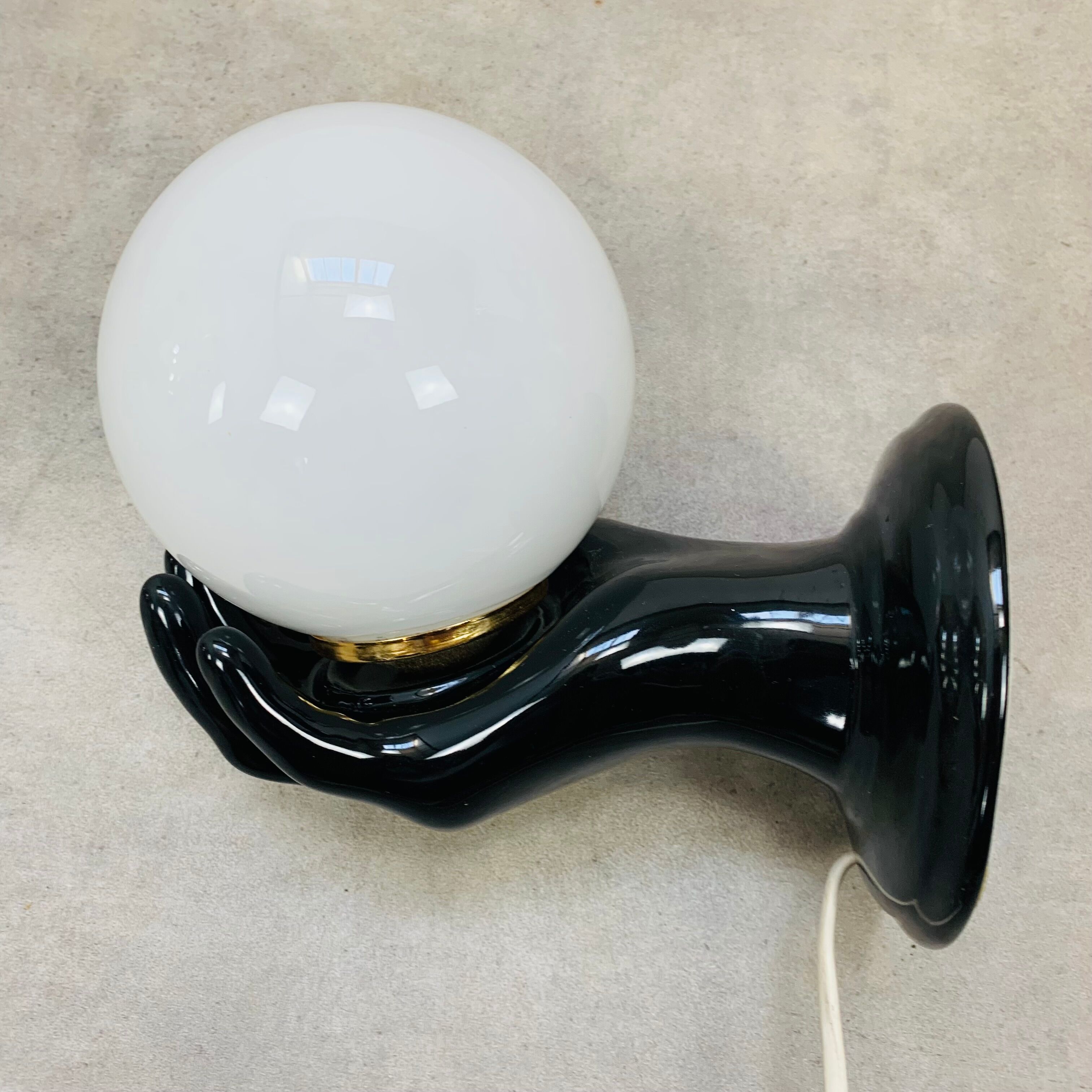 Black and opaline ceramic hand lamp