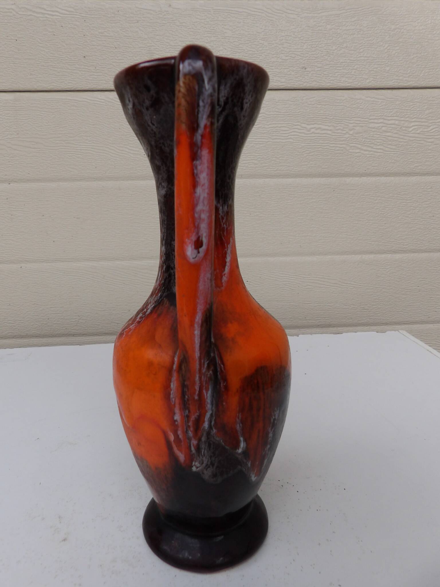 Vase with two orange handles