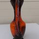 Vase with two orange handles