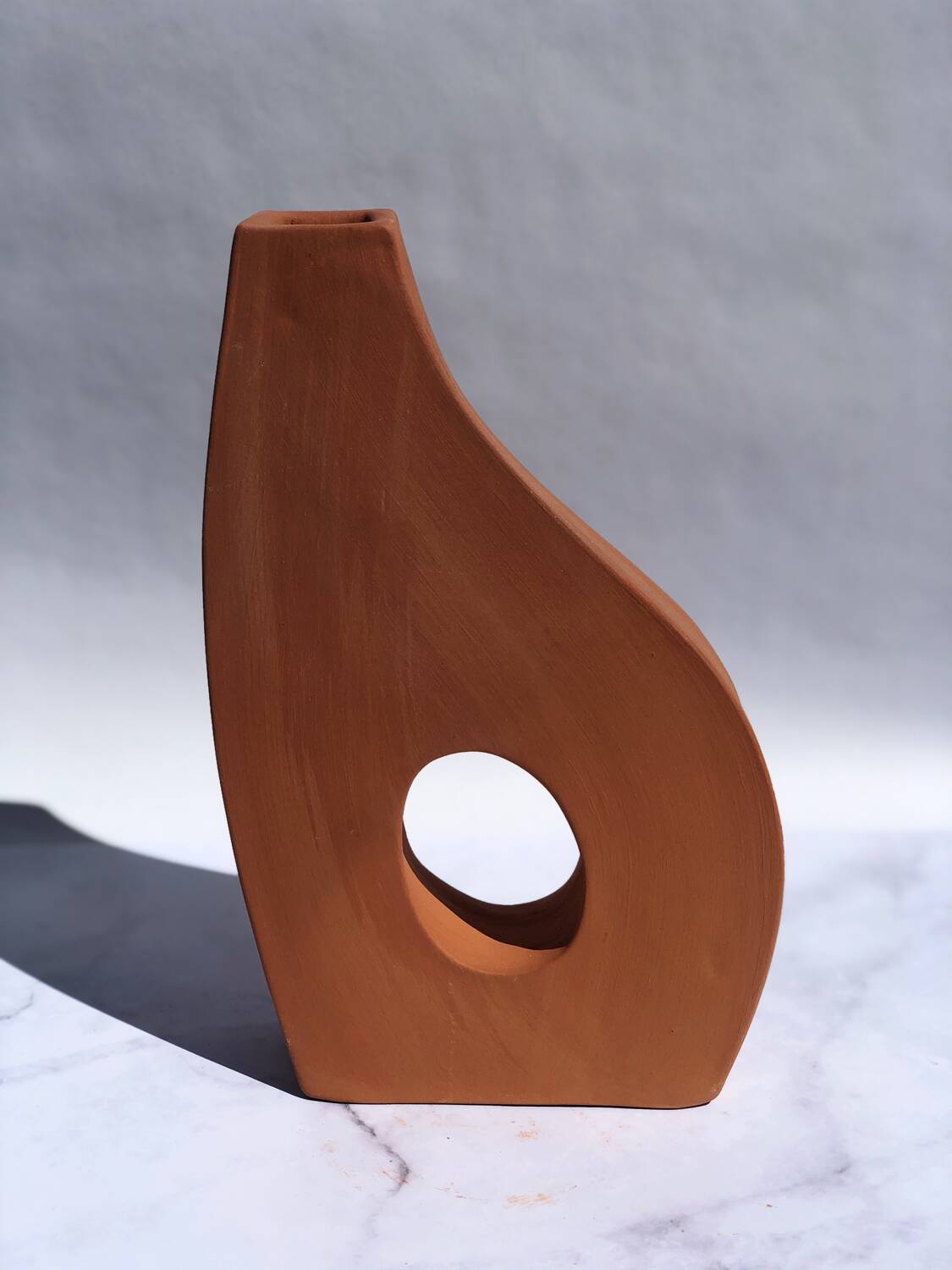 Handmade red earthenware flat vase