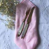 Old brass forks and knives and mother-of-pearl handle