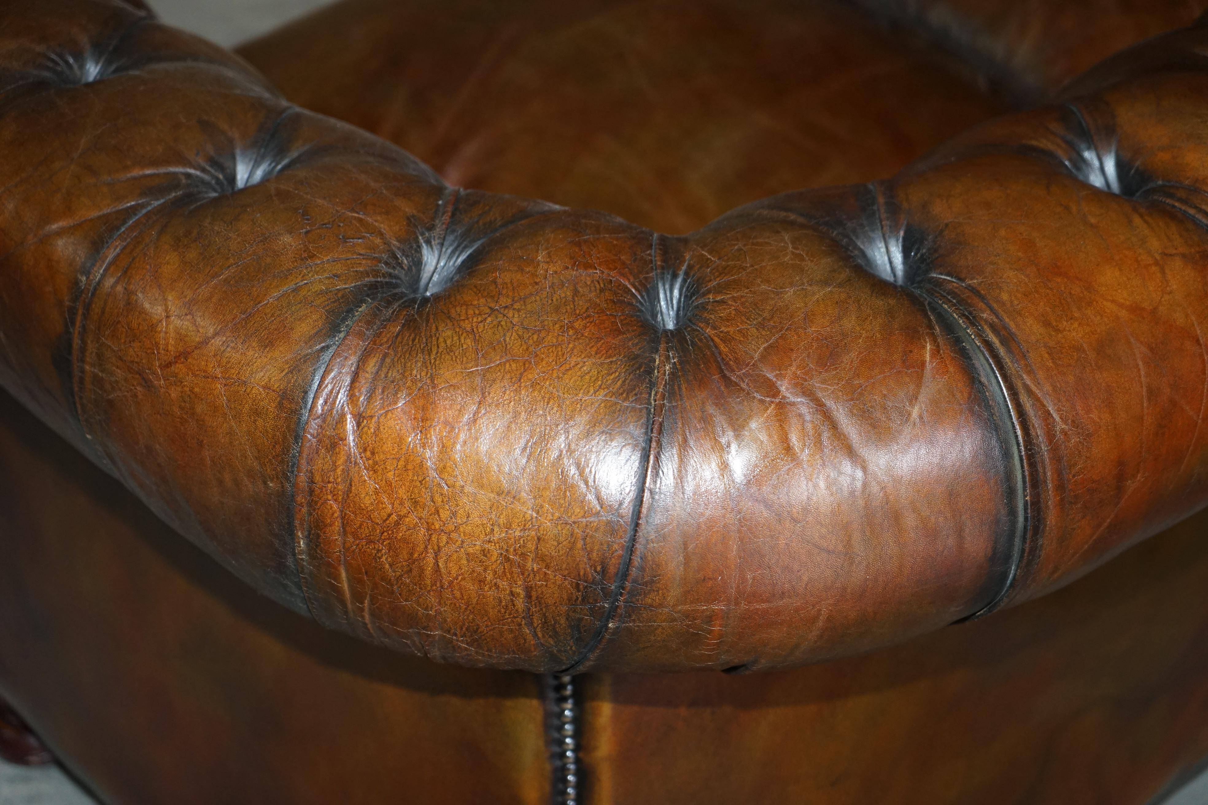 Restored leather Chesterfield sofa, walnut legs.