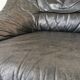 Pair of black leather armchairs from the 80s