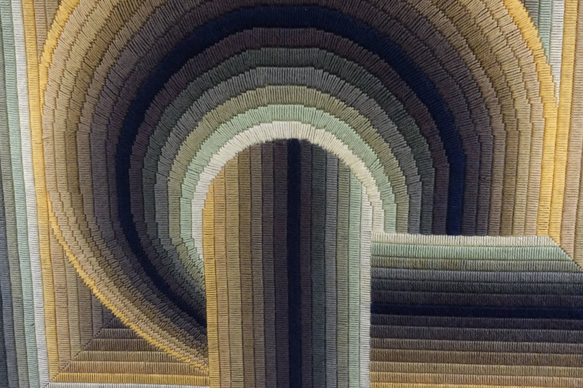 Kinetic tapestry with geometric pattern by Patrice Allard.