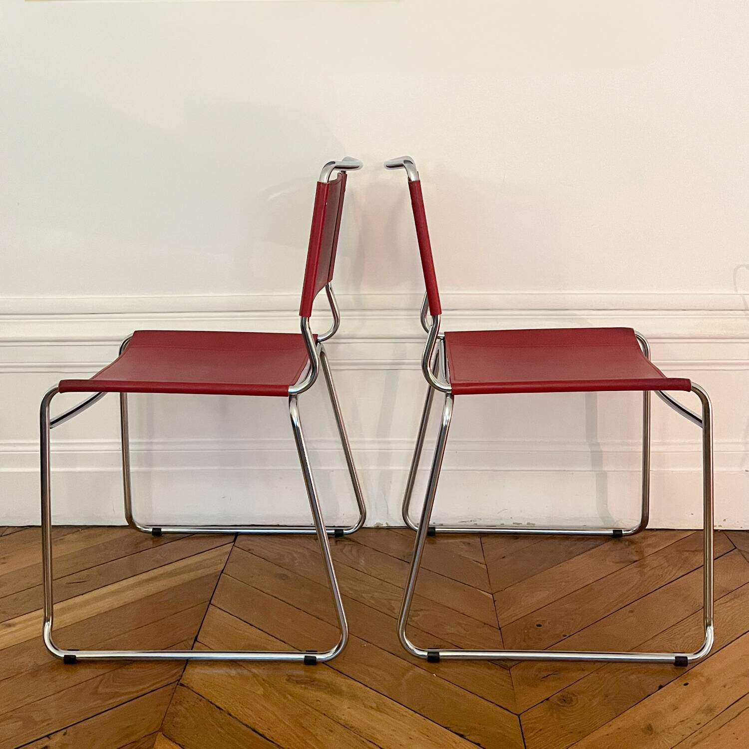 Set of 4 chairs in red leather and chrome tubular metal
