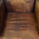Dark brown design armchair made of sheepskin leather