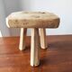 Vintage Danish brutalist tripod stool made of solid oak.