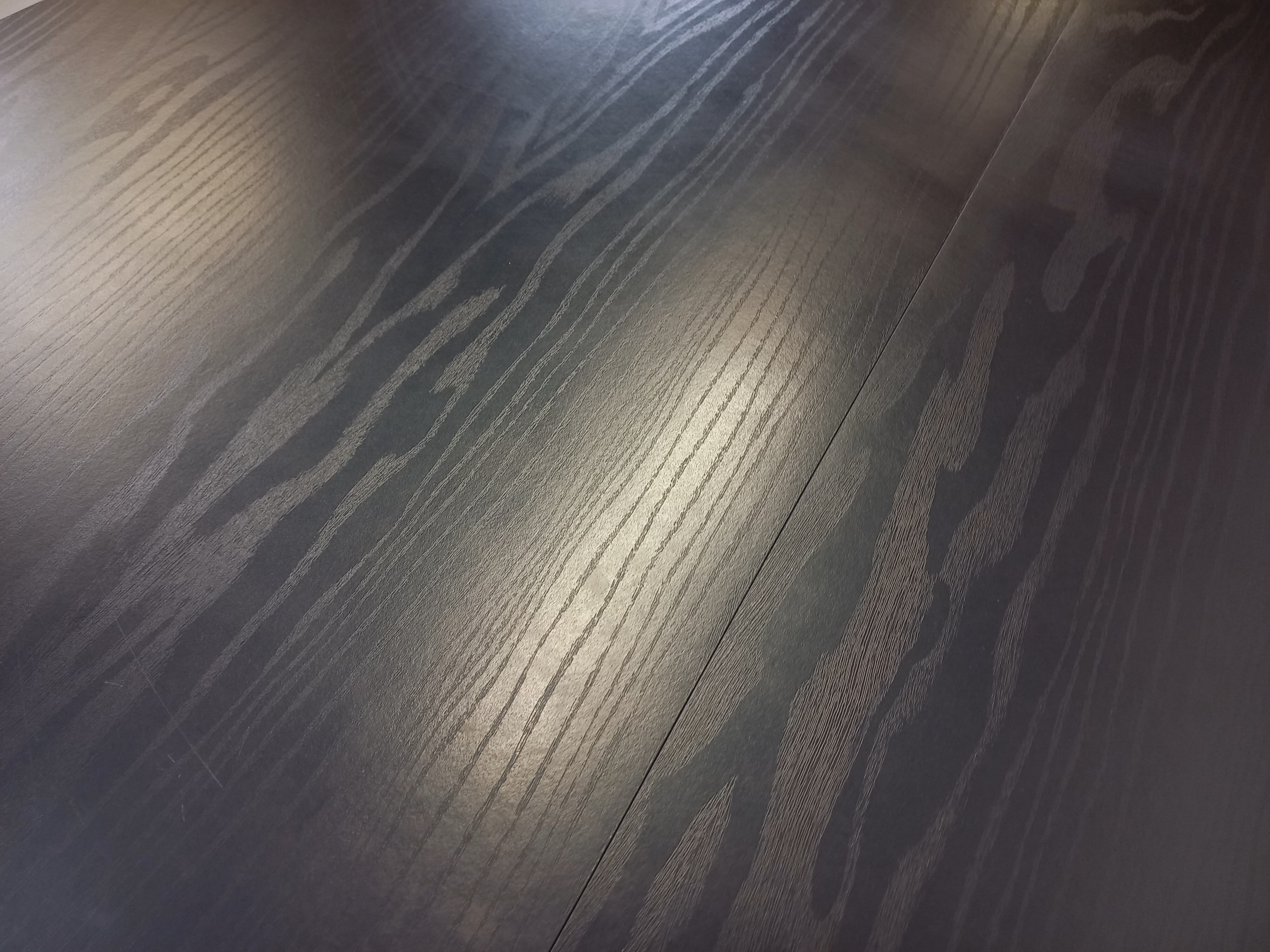 Vintage dining table in melamine with a black wood effect and chrome metal.