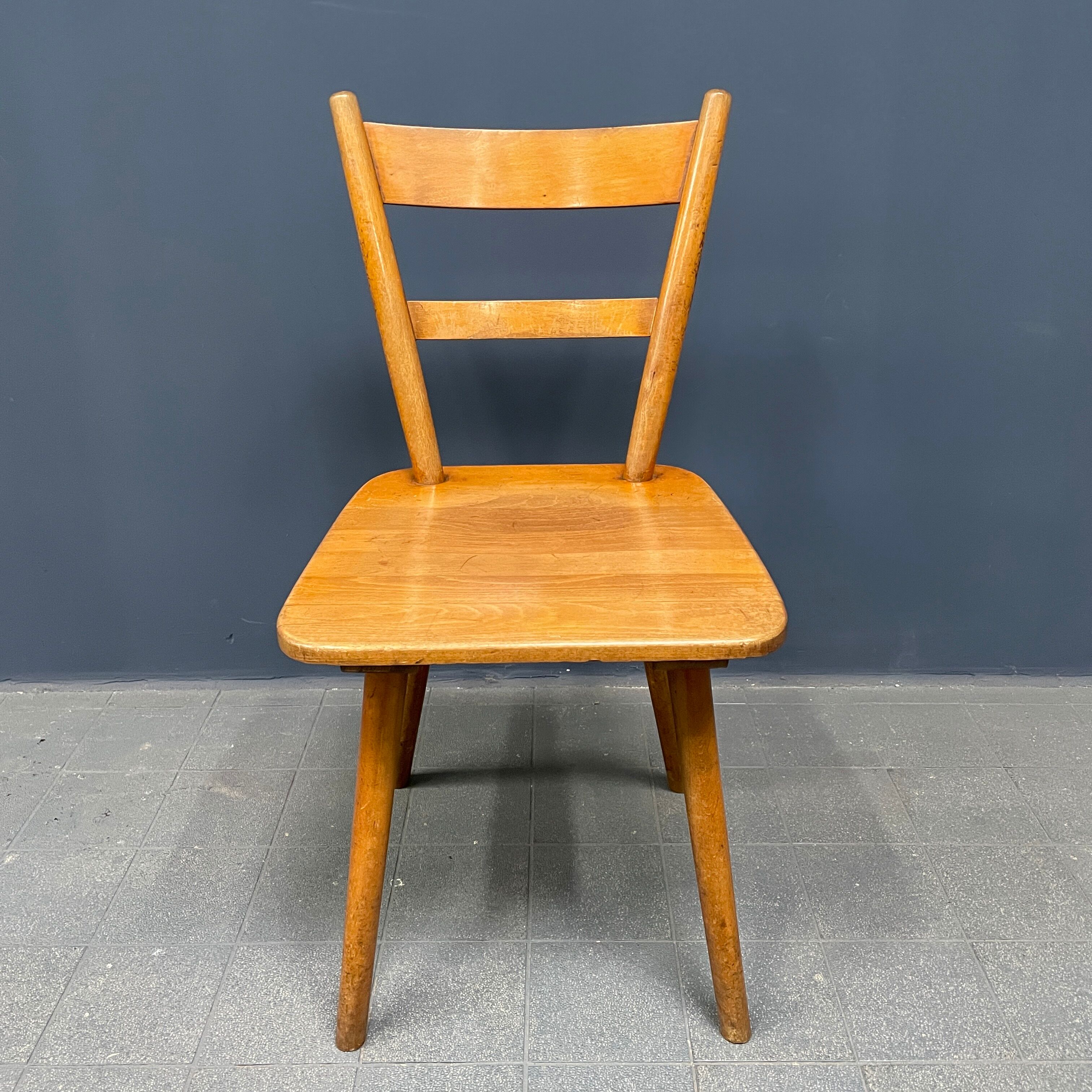 Set of eight german stick chairs from the 1950
