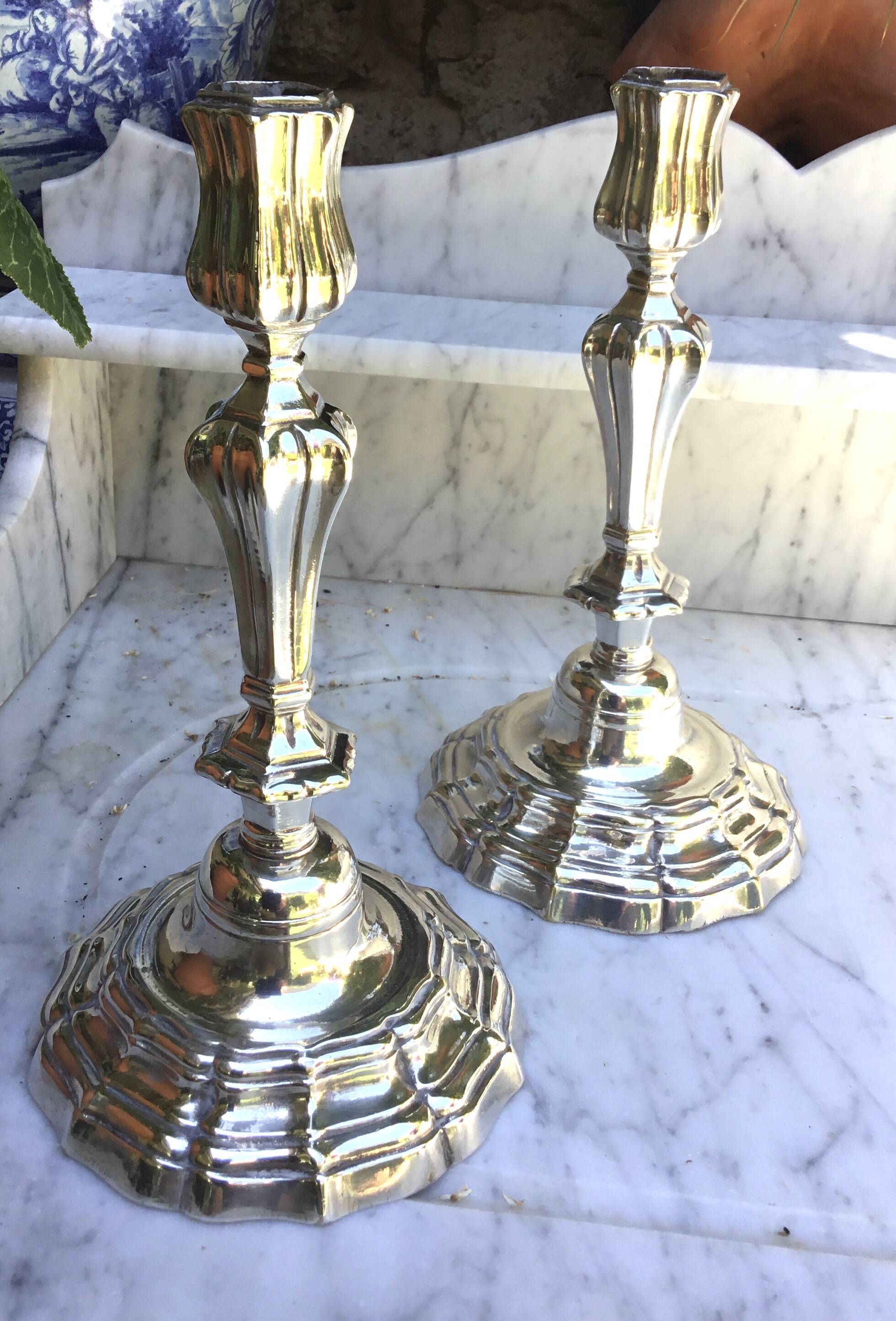Pair of silvered metal candlesticks in the Louis XIV style.