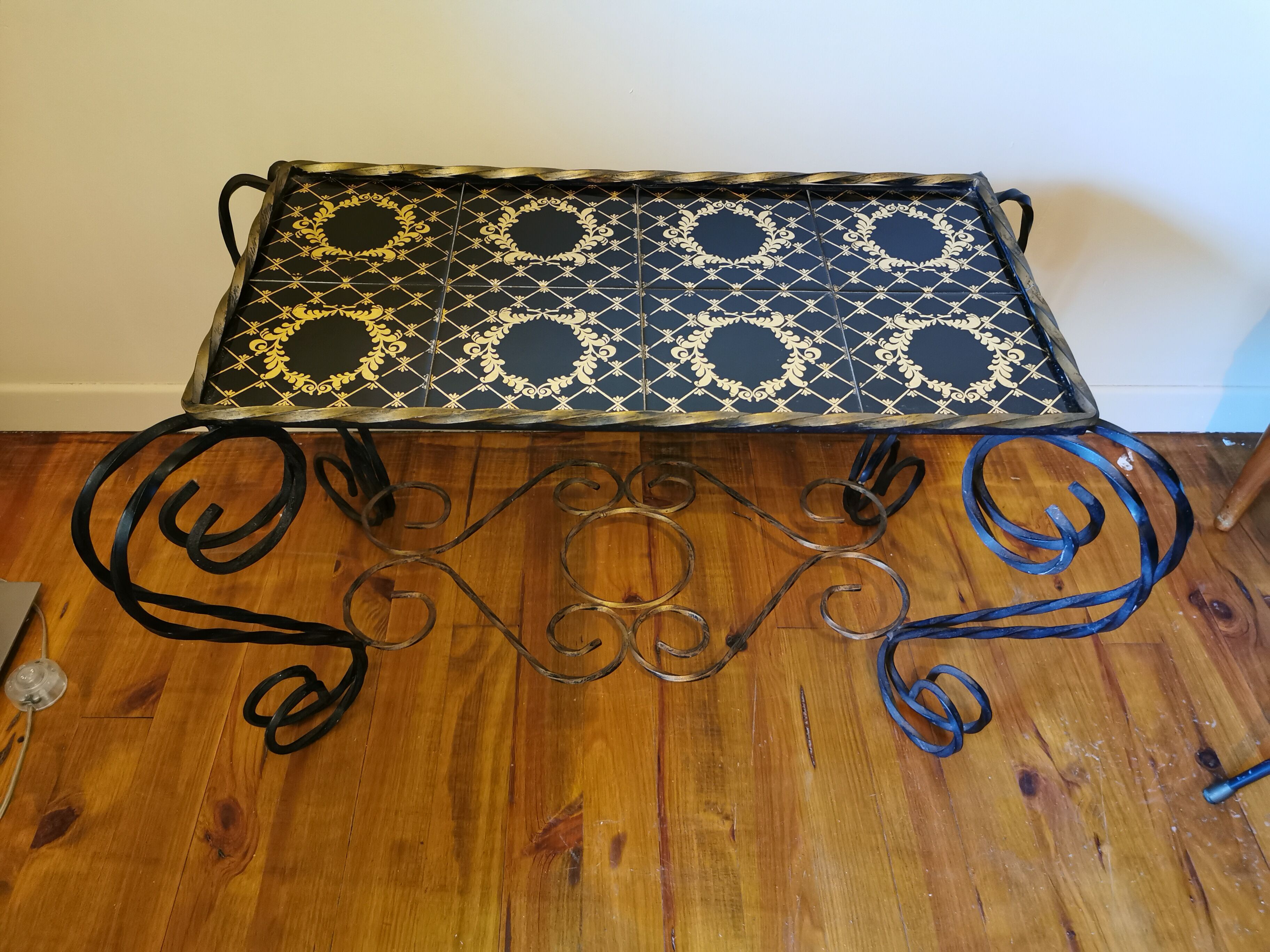 Vintage coffee table wrought iron and black and gold ceramic