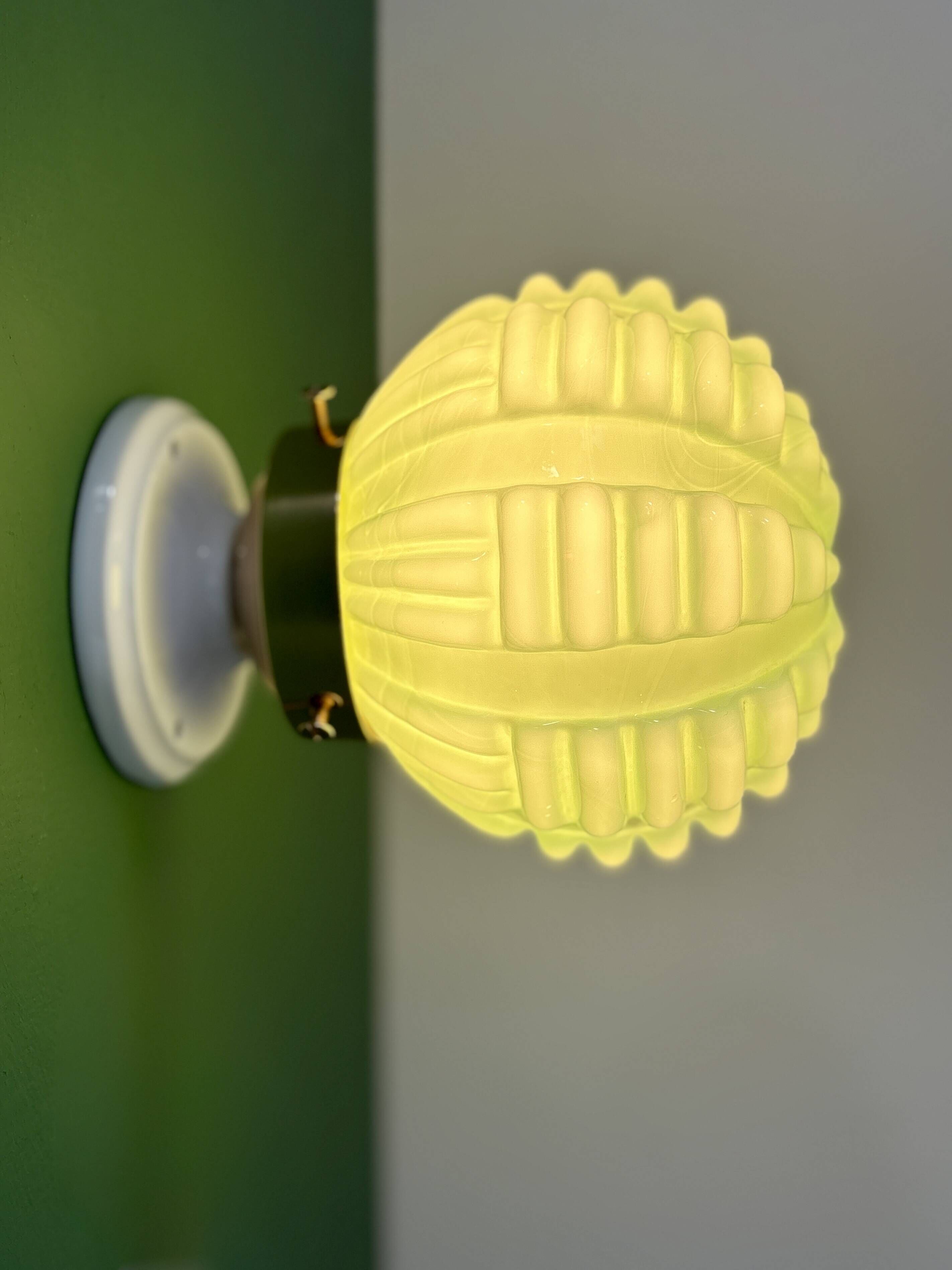 Vintage Art Deco globe wall light in pale green opaline.