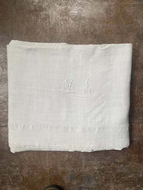 Antique linen sheet with monogram VI