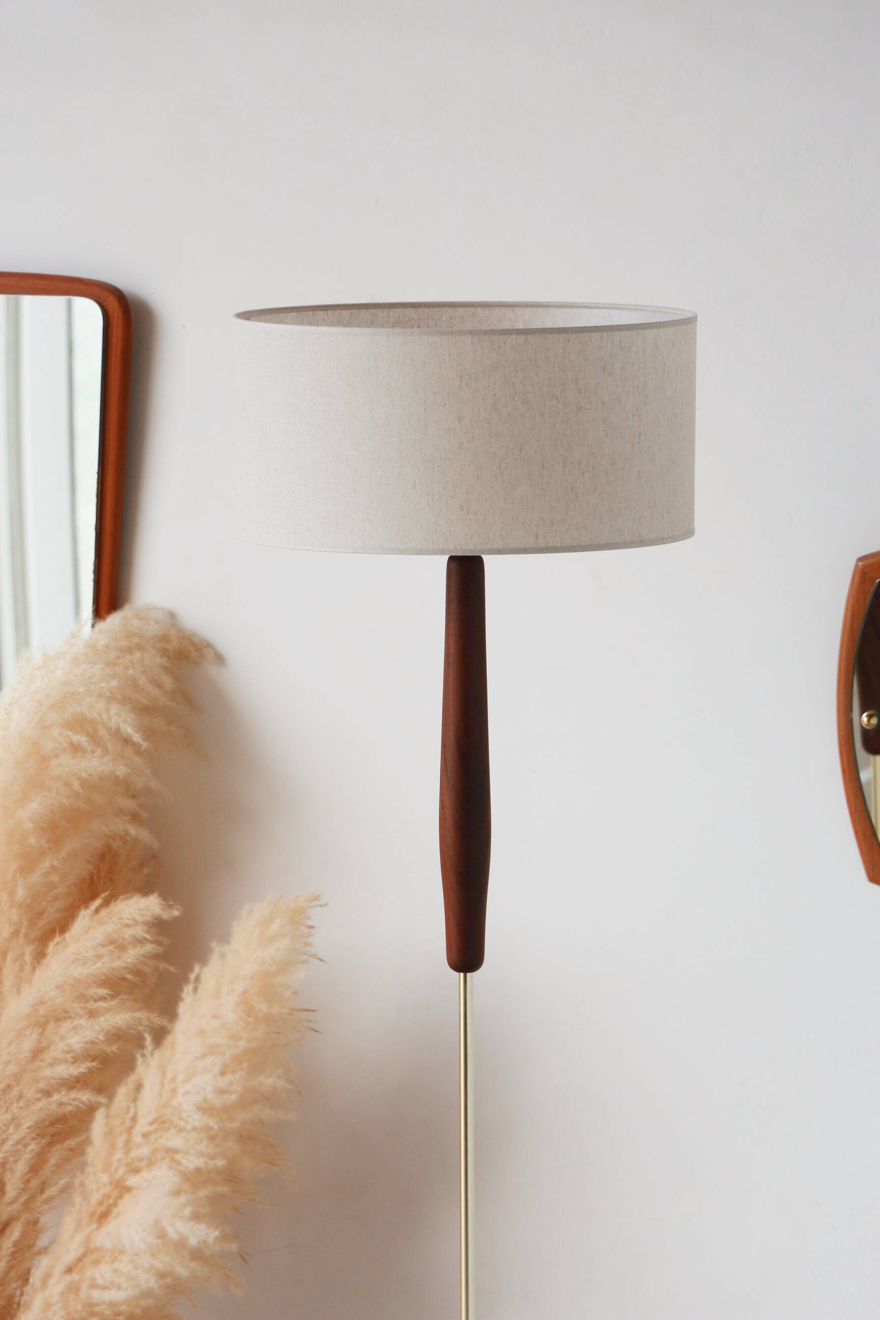Vintage floor lamp in teak and brass with a cream shade.
