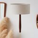 Vintage floor lamp in teak and brass with a cream shade.