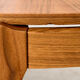 Coffee table in walnut with a ceramic top.
