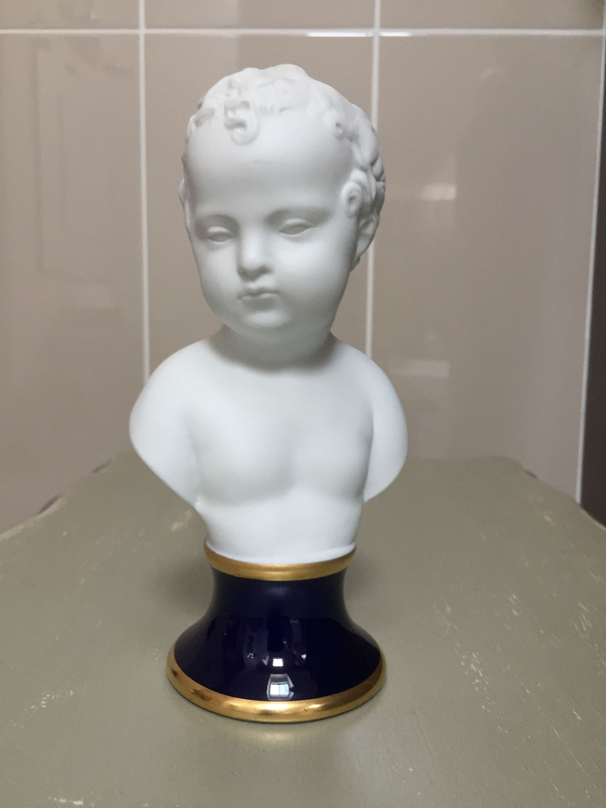 Child bust in limoges porcelain