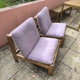 Pair of solid wood and leather lounge chairs, European work, circa 1970.